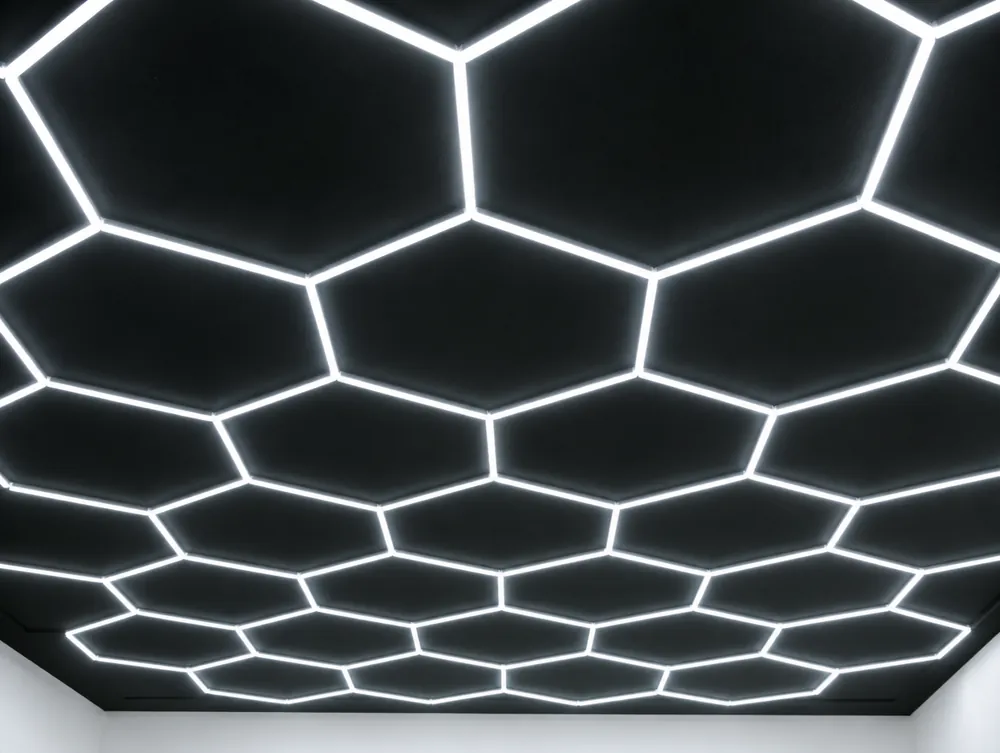 The hexagon LED grid glowing across the shop's black ceiling.